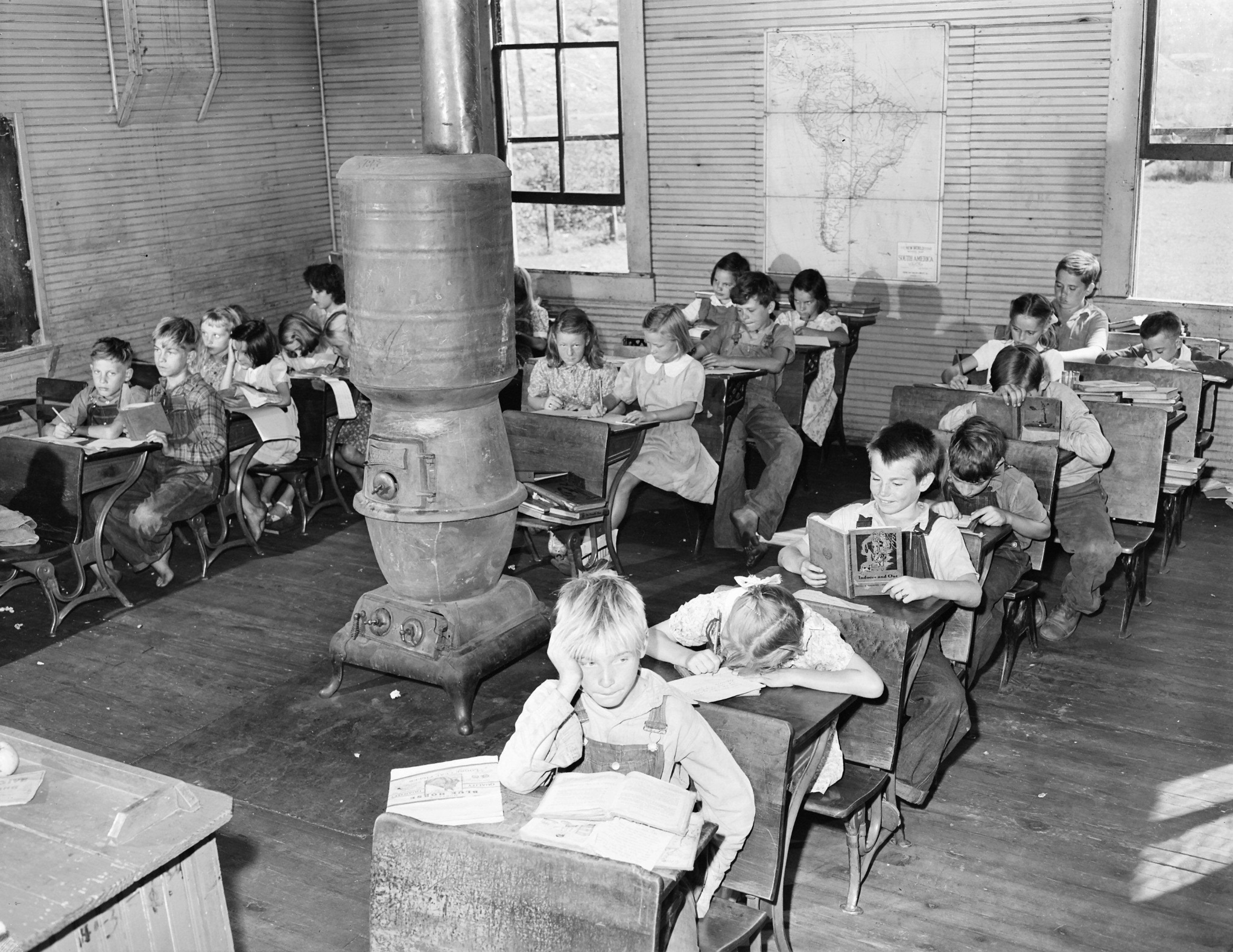 Forty seven pupils in the second, third and fourth grades attended school in this one room with one teacher. Bell County, KY, 1945. 